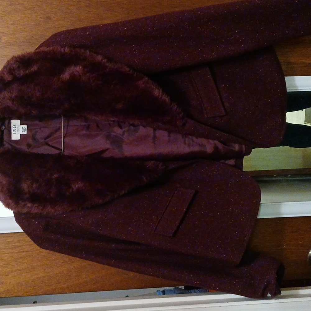 Short jacket with fur collar.  Gently used. I. Like new condition.